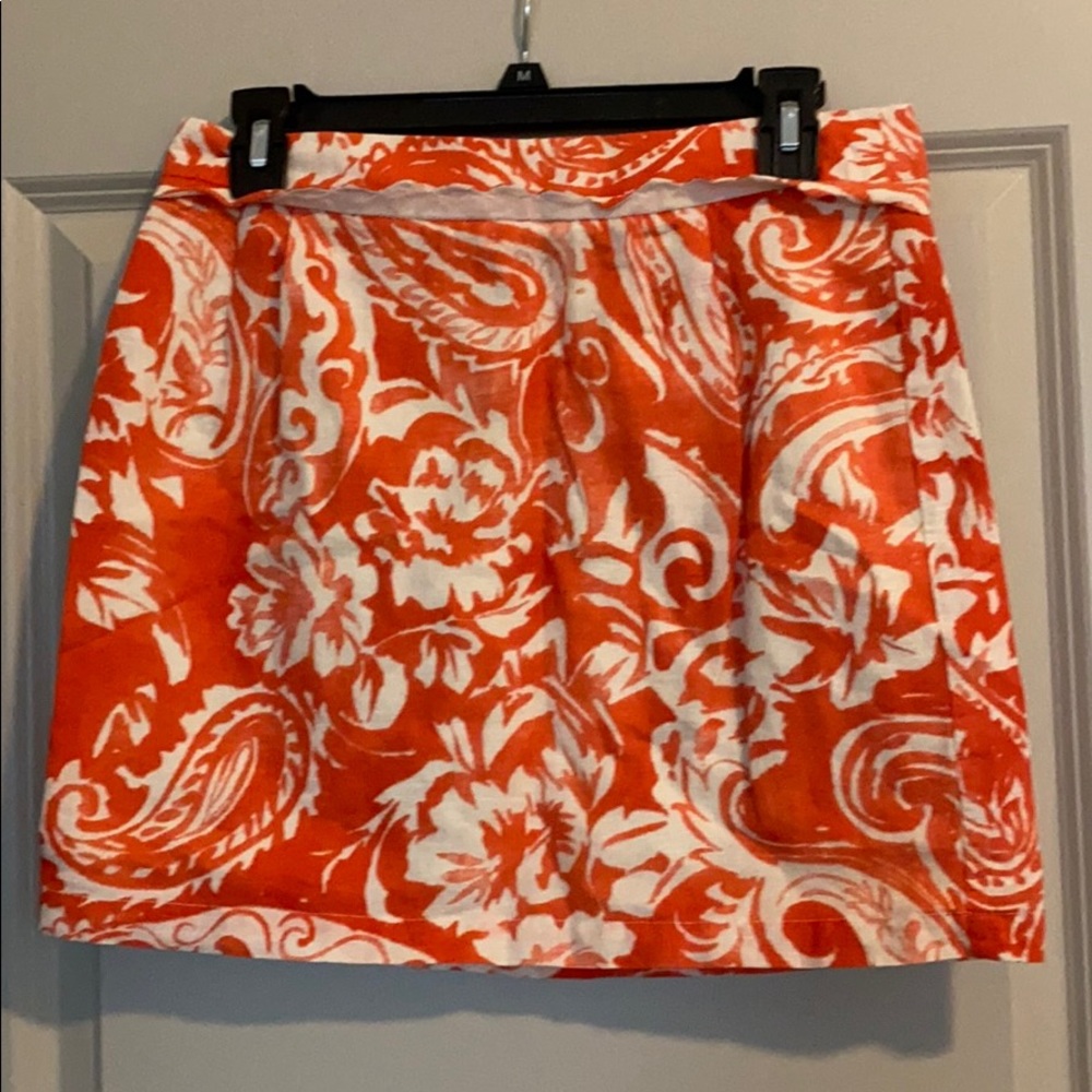 Orange patterned skirt with scalloped trim